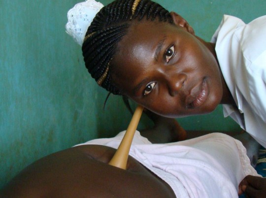 A midwife attending to an expectant mother in a health centre in northern Uganda. Photo: IRIN/Charles Akena