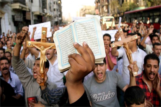 Christians and Muslims demonstrate in Cairo, Egypt, against the killing of Christian civilians in clashes with military policemen