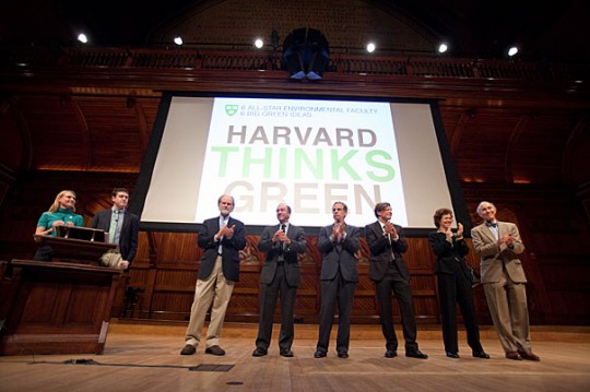 Photos by Jon Chase/Harvard Staff Photographer /At the first Harvard Thinks Green, six Harvard professors gathered at Sanders Theatre to provide just that kind of thinking. They included Eric Chivian (from right), Rebecca Henderson, Christoph Reinhart, Robert Kaplan, Richard Lazarus, and James McCarthy. Hosting the event were Office for Sustainability Director Heather Henriksen (far left at podium) and event co-founder Peter Davis '12.