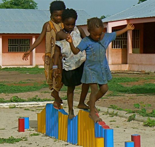 Children in Gantauda, Guinea-Bissau develop their motor skills on the balancing beam. Photo: IRIN/Kate Thomas