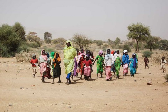 A Sudanese woman and children in East Jebel Mara, South Darfur