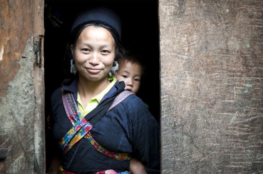 A H'mong woman and her baby in Sin Chai hill tribe village