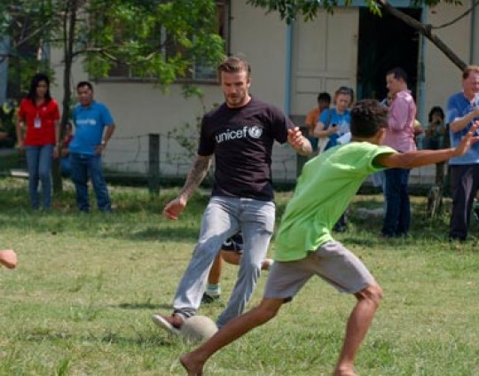 2 December 2011, Manila, Philippines - UNICEF Goodwill Ambassador David Beckham plays football with young people in a UNICEF supported centre for children who once lived and worked on the streets. Football is a lifeline for the children in the centre as it helps them build confidence, strength and self-esteem. ©UNICEF/2011/Villafranca