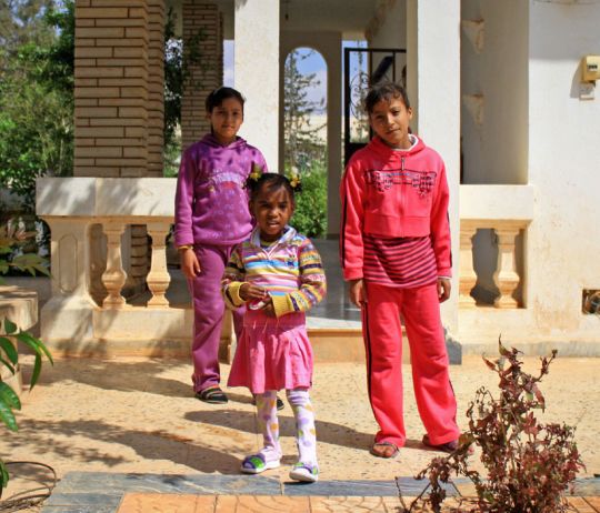 Displaced children from Ajdabiya play in the grounds of a converted construction camp in Benghazi, Libya. Photo: OCHA