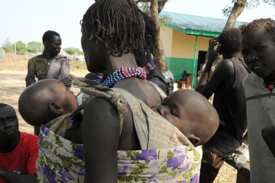 An internally displaced mother and her children among IDPs in South Sudan. Photo: UNMISS/Gideon Pibor