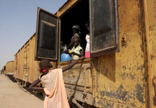 After waiting for over a year to go to South Sudan, some southerners have set up home in abandoned train carriages at Khartoum's Shajara railway station.
