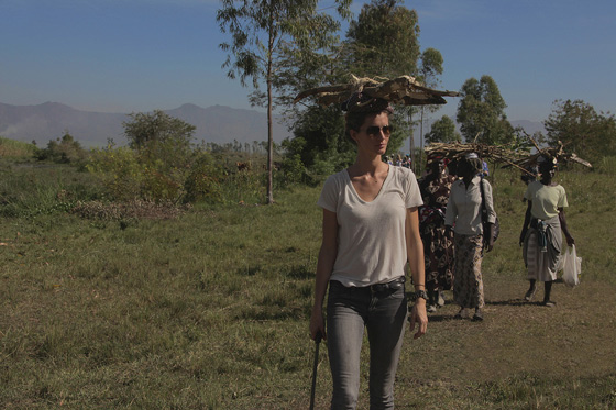 Gisele collecting firewood with women in Kisumu, Kenya.