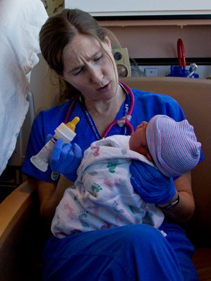 Registered nurse Janelle Stein feeds a bottle to Joey Gutierrez at UCSF Benioff Children's Hospital.