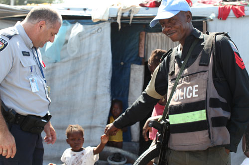 United Nations police (UNPOL) spokesperson Raymond Lamarre liaising with the displaced communities.