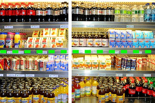 A program involving color-coded food labeling and adjusting the way food items are positioned in display cases was successful in encouraging healthy choices in a large hospital cafeteria. Before (left), sugar-sweetened soft drinks and juices were mixed together with diet beverages and low-fat dairy items. After (right), water, diet beverages, and other healthy choices are placed at or above eye level (dotted green line), while less healthy items are below./ Photos courtesy of Massachusetts General Hospital