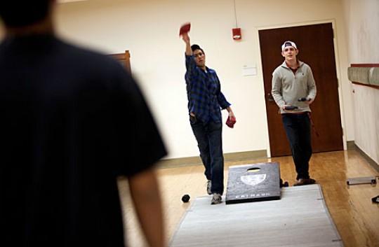 “We’re hoping to expand and get the word of cornhole out in the Harvard community,” said Jamie Dickerson '14 (right). On the left is Harry Chiel '14.
