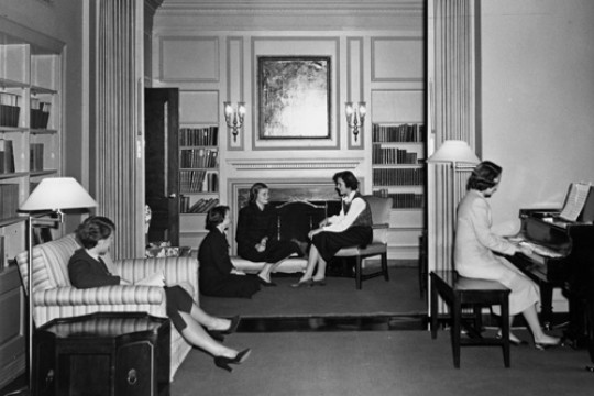 A group of Radcliffe students socialize in a common room in Moors Hall circa 1950. Photo by Ronald E. Stroud, courtesy of Schlesinger Library, Radcliffe Institute