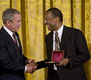 President Bush presents The Lincoln Medal to Dr. Benjamin Carson, right, a renowned pediatric neurosurgeon at Johns Hopkins Children's Center in Baltimore, during  a ceremony in honor of Abraham Lincoln's 199th birthday, in the East Room of the White House in Washington, Sunday, Feb. 10, 2008.  (AP Photo/J. Scott Applewhite)