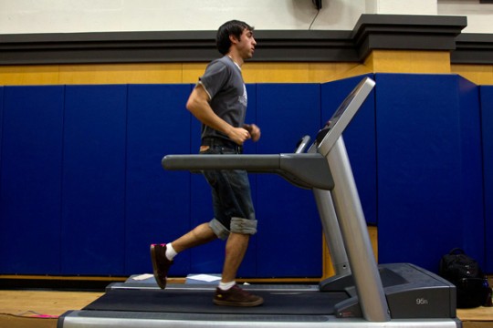 Emmanuel Jauregui, a second-year medical student, takes a running test to measure is body alignment while in motion at the UCSF Orthopaedic Institute's booth at the wellness expo.