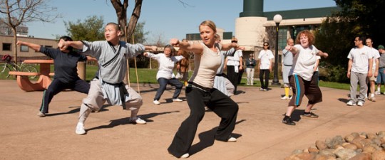 Lisa Becker, a biology research assistant, learns Shaolin Kung Fu from the masters in the class at Stanford. (Photo: L.A. Cicero)