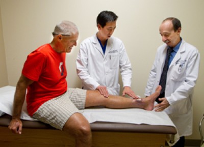 Barnes meets with James Chang and David Lowenberg, who collaborated to save his lower left leg.