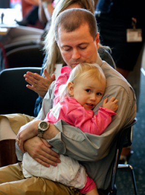 Daniel Bitner, with his 2-year-old daughter, Madeline, at a March 4 event honoring a new therapy that has changed his and other kidney-transplant recipients’ lives.