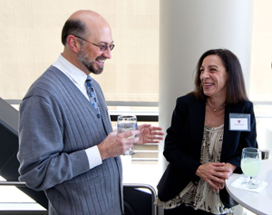 Kidney transplant surgeon Stephan Busque chats with Emilia Connor at a lunch on March 4 for her and other kidney recipients who have been weaned from the immunosuppressant drugs that most recipients usually have to take for the rest of their lives.